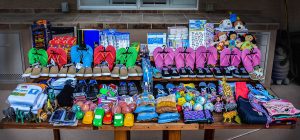 Toys, shoes, and school supplies line up waiting to be given to children around the world.  Photo courtesy of Olivia Smith