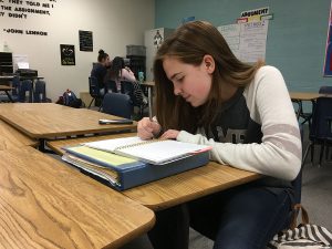 To get ready for the busy week ahead, Bailey Allen, 10, starts to fill her planner with the weekly activities. Photo by Saveria Farino