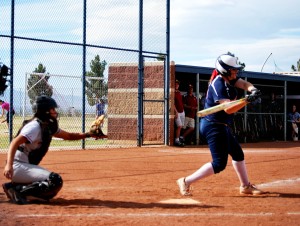 #13, Katie Dawson, senior, hits a double sending in two runners to bring the Cougars up 13-0.  (Photo by Jolie Ross)