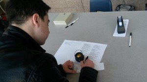 Zil Joyce Dixon Romero fills out a form to have a limerick delivered on St Patrick's Day. NEHS will be holding their fundraiser through tomorrow.(Photo by Ashly Riches)