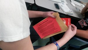 Student donates Target gift card to homeless youth drive.  (Photo by Ashly Riches)