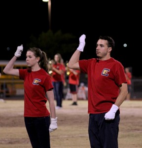 Senior drum majors Sara Petty and Ryan Everson lead the marching band at during a home game. (Photo by Hailey Hoffman)
