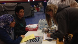 Prepared to have her blood drawn, Kaitlin Dute, junior, signs up to donate. (Photo by Karissa Erven)