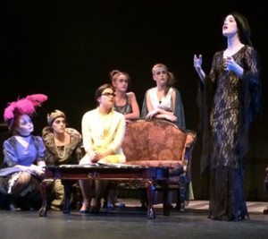 Portraying Morticia Addams in the all-state production of The Addams Family Musical on November 13, Briley Oakley, junior, sings “Secrets.” (Photo by Ryann Heinlen)