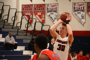 Lining up his shot, Kennedy Koehler, 12, attempts to make a free throw. Photo by Kyle Musler