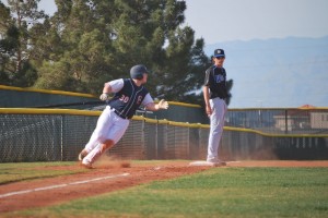 #30 Caden Spillsbury, senior, rounds third and scores a run for the Cougars during the fourth inning of the game against Basic. (Photo by Jolie Ross)