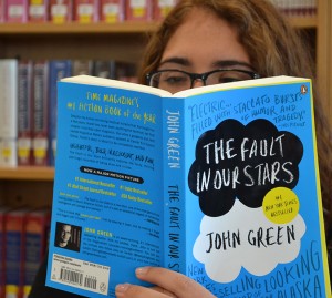 A student indulges in The Fault In Our Stars in the library.  (Photo by Leilah Lockett)