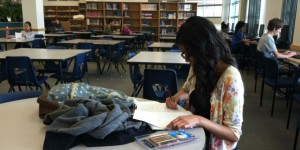 Hard at work, a student takes advantage of the serenity in the library to study for upcoming exams. (Photo by Ryann Heinlen)