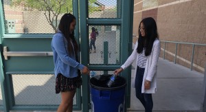 Caption for photo: Freshmen Vanessa Vidas and Alessandra Baldono recycle their water bottles during lunch.