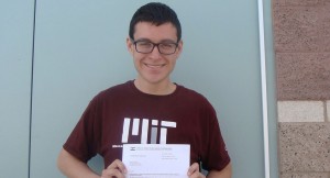 Eric Lujan, senior, holds the letter from State Farm, the sponsor for the NMSC scholarship. He will use the money towards his tuition at MIT.  (Photo by Karissa Erven)