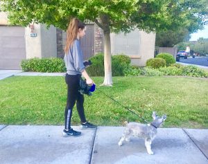 Cooling down after her workout, Regina Dispa, 11, takes her dog on a stroll around the neighborhood. Photo by Paula Dispa