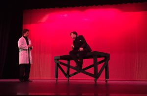 The fall play includes a scene shared between Edgar Allen Poe, played by Marshall Looney, 11, and his doctor, Tristan Dilks, 11, in a heated discussion. Photo by Sage Tippie