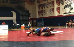 Pinning a Gator with determination, Jordan Marzka, 10, dominates his opponent on the mat. Photo By Sage Tippie