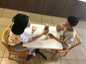 Enjoying their crepes at Crepe Shack & Waffles, Janelle Rafanan, 11, and Corey Masicampo, 10, play a game of Jenga while on a date.