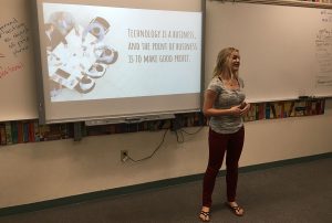 With appropriate hand gestures and effective pauses, Allie Gurr, 10, presents her topic to the board for her AP seminar exam. Photo by Karen Pegueros