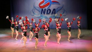 Striking a pose, the Cougarettes end their Pom routine, which earned eighth in the nation. Photo Courtesy of Sara Advent