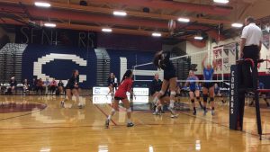 During a set, Safana Boutahiri, 12, spikes the ball to try and score against Basic. Photo by Sage Tippie