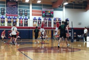 Ben Bloss and Nik Purser attempt to block the Panthers on the last point of the season on May 15. Photo by Joshua Christensen.