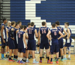 The men’s varsity volleyball team huddles around Coach Johnson during the first match of the game against Foothill High School on April 22. Coronado defeated the Falcons in the first match with the final score of 29-31. (Photo by Kacie Leach) 