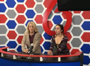 Broadcasting members Alicia Howard, 12, and Elli Doctors, 11, practice their lines on set before the cameras begin to roll. Photo by Ryan Kelleher