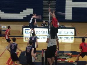 Hitting off an outside set from the setter, senior Ryan Garlick takes his approach and crushes the ball. Photo courtesy of Josh Christensen