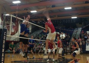 In senior night action, Ryan Garlic smashes the ball on Green Valley for an easy kill. Photo by Joshua Christensen. 