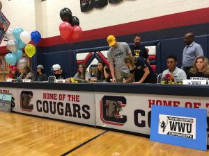 While athletes await their turns to sign contracts for their college teams on Monday, Nov. 14, Kennedy Koehler, 12, commits to UCSD. Photo by Saveria Farino