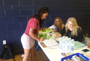 At the blood drive, juniors Alicia Howard and Karina Rodriguez assist Yosahandi Hernandez, junior, in signing up to donate blood on Thursday, Oct. 1. Photo by Lauren Smith