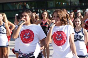 After a performance by the cheer and dance teams, seniors Niki Hadighi, student body treasurer, and Ariann Sanford, student body president, kick off the barbecue. Photo by Lindsay Mitchell