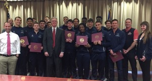 The men’s varsity basketball team took a moment to take a picture with Mayor Andy Hafen after receiving recognition for winning the Sunrise Division I bracket and going to state finals. Photo courtesy of Coach Kaufman