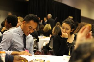 Taking a break for lunch, seniors Justin Balanga and Nina Machin continue to discuss their topics at the Sun Youth Forum. Photo by Taylor Dickerson