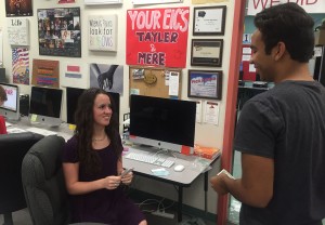 In order to pick up his yearbook before everyone else, Brandon Garcia, 10, buys a ticket from co-editor-in-chief Meredith Hadley, 12, for the yearbook signing party. Photo by Lauren Smith