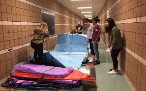 After school on Friday, members of StuCo stayed to hang all of the signs and decorations for the upcoming Homecoming Spirit Week. Photo by McKenna Cooley