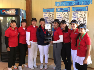 After a glorious victory at state, the women's Varsity Golf team accepts their trophy. Photo courtesy of Mr. Piccininni