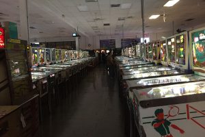 Serious players lineup to play the machines at the Pinball Hall of Fame. Photo by McKenna Cooley