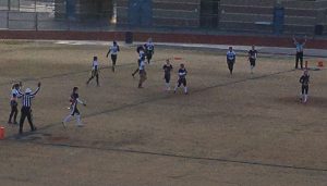 The referees signal the Cougars first touchdown in the first half. Photo by Ryan Kelleher