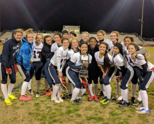 After their big win, the Lady Cougs pose one more time for the season with their trophy. Photo courtesy of Mr. Piccininni