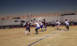 On her way to help her team, Caitlin Shannon, 10, maneuvers around oncoming Sierra Vista players. Photo by Sage Tippie