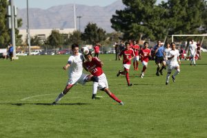 Fighting to keep the ball, Preston Judd, 12, battles with a Valley player for control of the game. Photo by Lindsay Mitchell