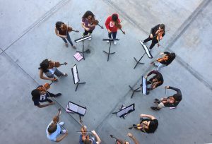 Orchestras Symphonic class breaks into Violin “sectionals” during third period on Oct. 12, practicing in individual groups in preparation for their fall concert. Photo by Bekah Denny 