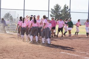 After their winning game, the Cougars go down the line congratulating each other. Photo by Giana Haynia